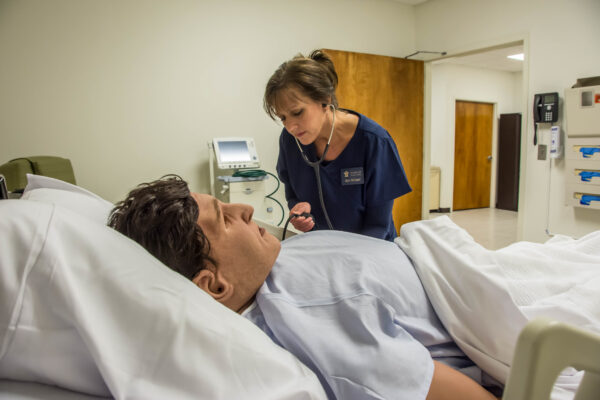 Nursing student checking blood pressure